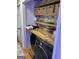 Laundry room with shelving above the modern washing machine and dryer at 211 Groveland Dr, Peachtree City, GA 30269