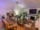 Bright living room features hardwood floors, a white brick fireplace and lovely decorations at 211 Groveland Dr, Peachtree City, GA 30269