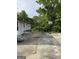 Concrete patio space in backyard with a basketball hoop, picnic table, and back entrance to home at 5225 Silhouette Sw Ln, Mableton, GA 30126