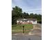 Inviting single-story home with a bay window, a front yard and a long driveway at 5225 Silhouette Sw Ln, Mableton, GA 30126