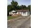 Charming single-story home with gray siding, brick accents, and a spacious concrete driveway at 5225 Silhouette Sw Ln, Mableton, GA 30126