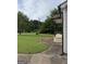 Side view of home with manicured lawn, decorative landscaping and gray siding at 5225 Silhouette Sw Ln, Mableton, GA 30126