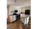 Modern kitchen with stainless steel appliances, a breakfast bar, and ample cabinet space at 5225 Silhouette Sw Ln, Mableton, GA 30126