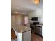 The kitchen has an island, stainless steel appliances, updated cabinets, and modern subway tile backsplash at 5225 Silhouette Sw Ln, Mableton, GA 30126