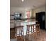 Well-equipped kitchen with a breakfast bar, modern appliances, and ample counter space at 5225 Silhouette Sw Ln, Mableton, GA 30126