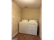Laundry room featuring new white washer and dryer at 5225 Silhouette Sw Ln, Mableton, GA 30126