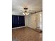 This living room features a ceiling fan, luxury vinyl flooring, and a barn door for added character at 5225 Silhouette Sw Ln, Mableton, GA 30126