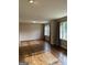 Bright living room with gleaming hardwood floors and natural light from large windows at 5225 Silhouette Sw Ln, Mableton, GA 30126