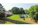 Overhead view of the large backyard with a swimming pool, trampoline and plenty of room to roam at 125 Kayla Ct, Locust Grove, GA 30248