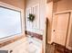 A luxurious soaking tub with tile surround and decorative window at 125 Kayla Ct, Locust Grove, GA 30248