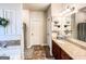 Bathroom showcasing a decorative mirror, granite vanity, and tiled floor at 125 Kayla Ct, Locust Grove, GA 30248