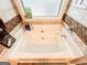 Large, inviting bathtub with tile surround, perfect for relaxation at 125 Kayla Ct, Locust Grove, GA 30248