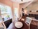 Bright breakfast nook with natural light and open view to the living room and fireplace at 125 Kayla Ct, Locust Grove, GA 30248