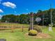 A street view of the community entrance and signage at 125 Kayla Ct, Locust Grove, GA 30248