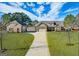 Beautiful home with lush landscaping and a detached garage, offering plenty of space and curb appeal at 125 Kayla Ct, Locust Grove, GA 30248
