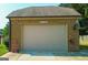Attached brick garage with a sign above the door that reads Bob's Garage at 125 Kayla Ct, Locust Grove, GA 30248