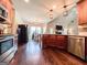 Open concept kitchen with stainless steel appliances and hardwood floors throughout the house at 125 Kayla Ct, Locust Grove, GA 30248