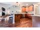 Open concept kitchen with stainless steel appliances and hardwood floors throughout the house at 125 Kayla Ct, Locust Grove, GA 30248