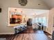 Stylish kitchen with a breakfast bar, granite countertops, stainless steel appliances, and an adjacent dining area at 125 Kayla Ct, Locust Grove, GA 30248