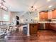Open concept kitchen with stainless steel appliances and hardwood floors throughout the house at 125 Kayla Ct, Locust Grove, GA 30248