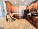 Well-equipped kitchen featuring granite countertops, ample cabinet space, and modern stainless steel appliances at 125 Kayla Ct, Locust Grove, GA 30248