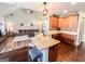 Gourmet kitchen with granite counters, breakfast bar seating, stainless appliances, and seamless flow into the living space at 125 Kayla Ct, Locust Grove, GA 30248
