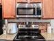 Close up on updated stainless steel appliances and cabinet storage for a modern kitchen at 125 Kayla Ct, Locust Grove, GA 30248