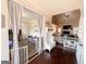 Open-concept living area featuring a fireplace, vaulted ceilings, and seamless flow to the adjacent living spaces at 125 Kayla Ct, Locust Grove, GA 30248