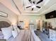 Spacious main bedroom with decorative ceiling, dresser, and television mounted on the wall at 125 Kayla Ct, Locust Grove, GA 30248
