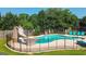 Fenced in inground pool with a slide and sun loungers creates a luxurious backyard oasis at 125 Kayla Ct, Locust Grove, GA 30248