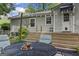 Backyard patio featuring a table and chairs with a pitcher of tea and glasses at 3119 Conyers Se St, Covington, GA 30014