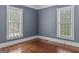 Charming bedroom features hardwood floors and two windows that provide lots of natural light at 3119 Conyers Se St, Covington, GA 30014
