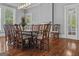 Light-filled dining room with hardwood floors, large windows, and views of the beautiful backyard at 3119 Conyers Se St, Covington, GA 30014
