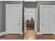The doorway looks onto a beautiful dining room with wooden table and chairs at 3119 Conyers Se St, Covington, GA 30014
