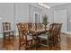 Formal dining room with refinished hardwood floors and an inviting dining table for entertaining at 3119 Conyers Se St, Covington, GA 30014