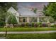 Charming home with a cozy front porch, beautiful landscaping, and a welcoming facade at 3119 Conyers Se St, Covington, GA 30014