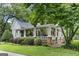 Charming home with a cozy front porch and beautiful landscaping at 3119 Conyers Se St, Covington, GA 30014
