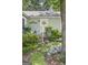 Charming entrance with white front door, surrounded by lush greenery and landscaping at 3119 Conyers Se St, Covington, GA 30014