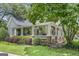 Charming home boasts a large, inviting wraparound porch and beautiful landscaping at 3119 Conyers Se St, Covington, GA 30014