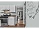 Bright kitchen features stainless steel appliances and a pass-through to another room at 3119 Conyers Se St, Covington, GA 30014