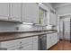 Kitchen with white cabinets, stainless steel appliances, and ample counter space for cooking at 3119 Conyers Se St, Covington, GA 30014