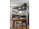 Cozy kitchen showcases dark cabinets, light wood floors, and a stainless steel refrigerator at 3119 Conyers Se St, Covington, GA 30014