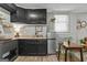 Well-equipped kitchenette includes modern appliances, storage, and a dining area with natural light at 3119 Conyers Se St, Covington, GA 30014
