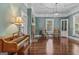 Spacious living room features hardwood floors, fireplace, and large windows for plenty of natural light at 3119 Conyers Se St, Covington, GA 30014