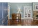 Bright living room with refinished hardwood floors, stone fireplace and vintage piano at 3119 Conyers Se St, Covington, GA 30014