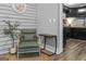 A comfortable space shows a green chair, plant and table with a clock above at 3119 Conyers Se St, Covington, GA 30014