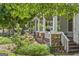 Inviting porch with stone accents and lush landscaping at 3119 Conyers Se St, Covington, GA 30014