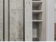 Shower features neutral tile, a glass door, and built-in shelving at 3119 Conyers Se St, Covington, GA 30014