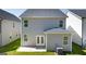 Back exterior of home featuring patio, double door and gray siding at 11884 Aukerman Way, Hampton, GA 30228