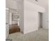 Carpeted bedroom with open doorway to kitchen and walk-in closet at 11884 Aukerman Way, Hampton, GA 30228